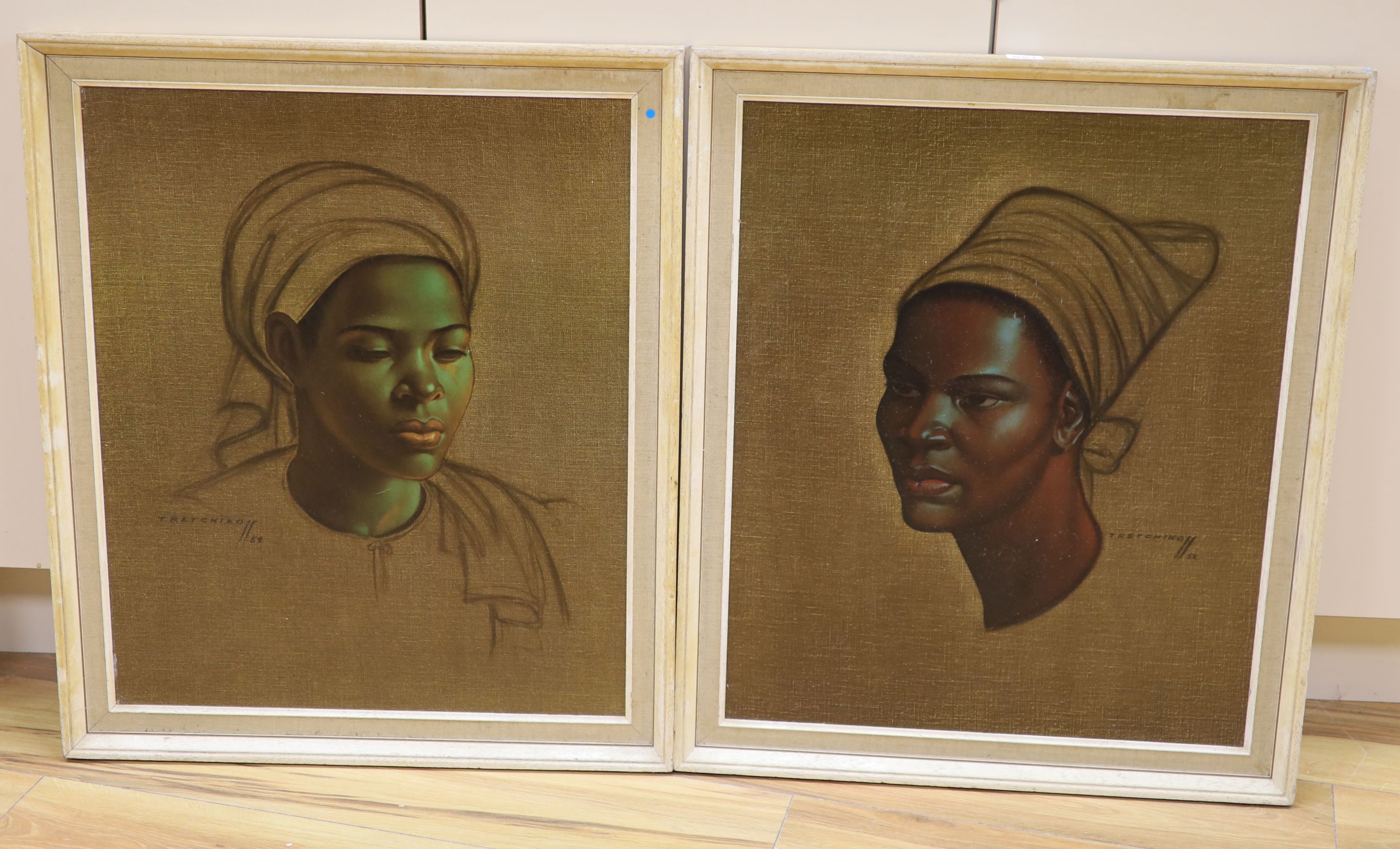 After Vladimir Tretchikoff (Russian, 1913-2006), pair of colour prints, Portraits of African women, 60 x 50cm
